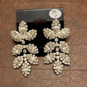 Leaf design rhinestone drop earrings with post back.